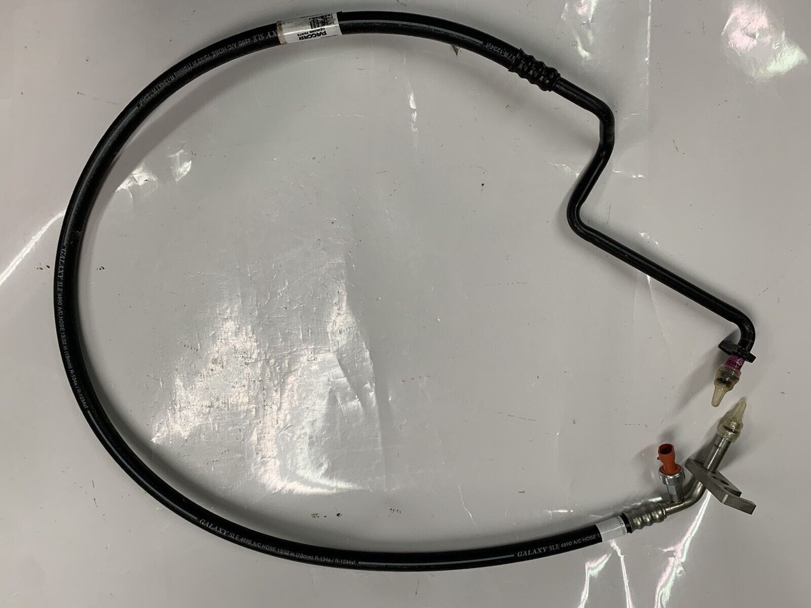 HL6001-063 | Genuine Paccar® A/C Compressor To Condenser Hose for Kenw